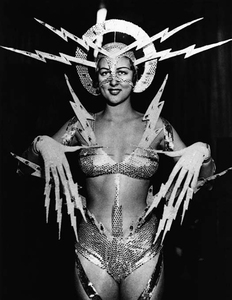 black and white photo of a woman in a strange electric themed costume