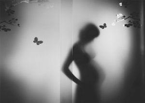 a pregnant woman in silhouette