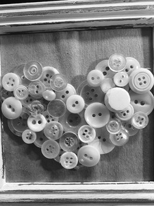 Buttons piled in the shape of a heart