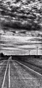 Black and white photo of a country road
