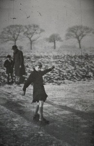 vintage photo of a child sliding on ice