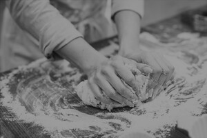 Vintage photo of hands working dough