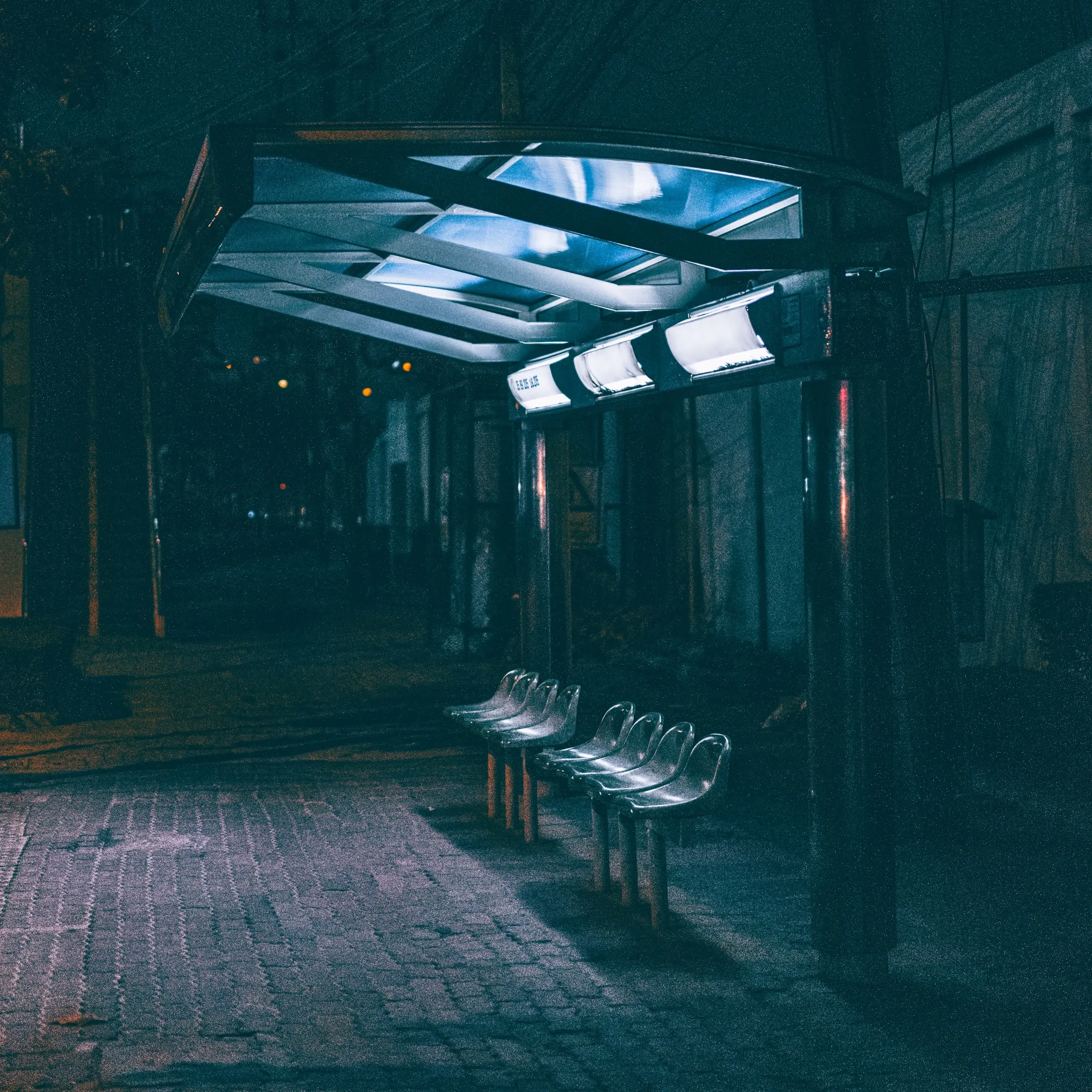 A bus stop at night