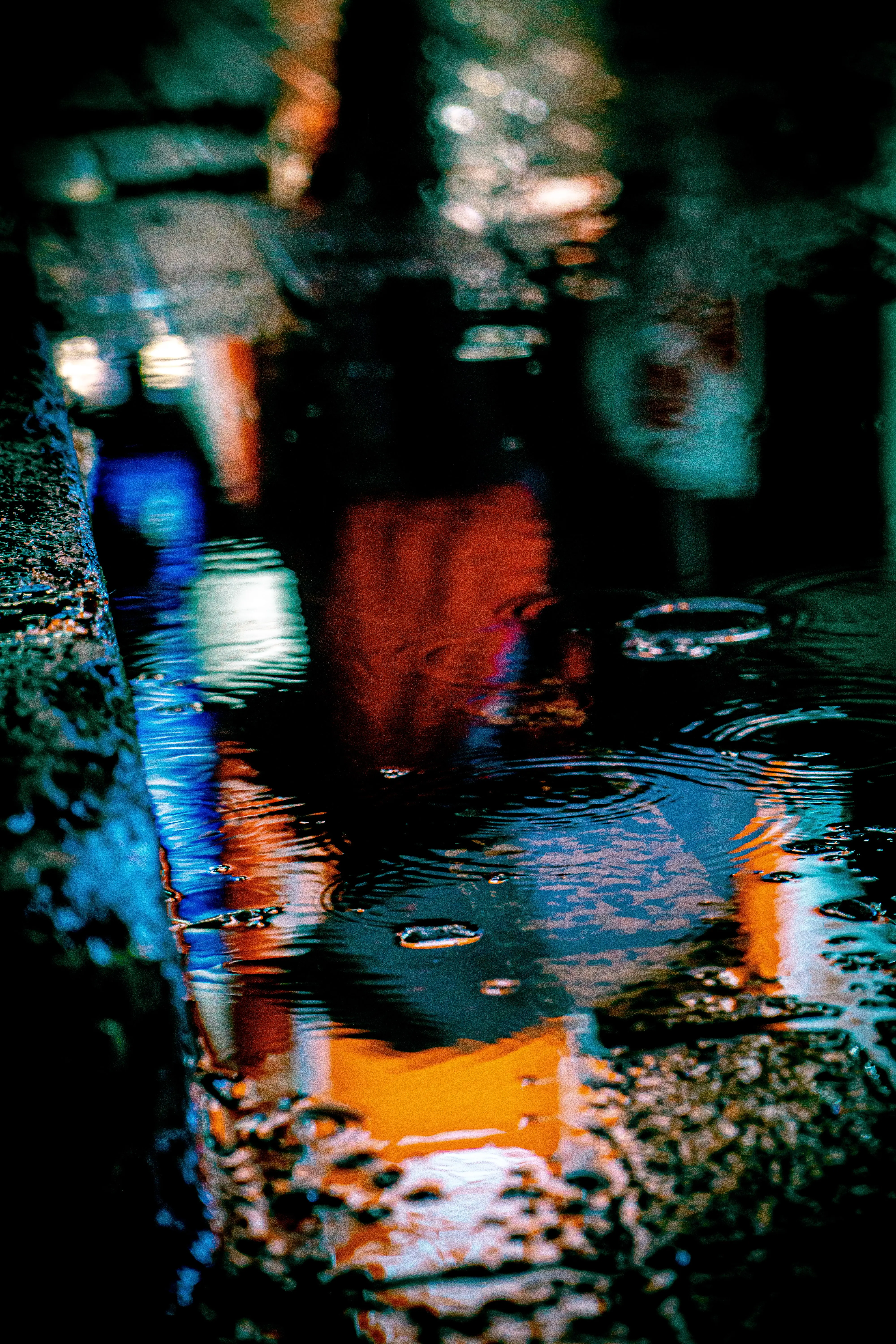 Neon lights reflected in a puddle