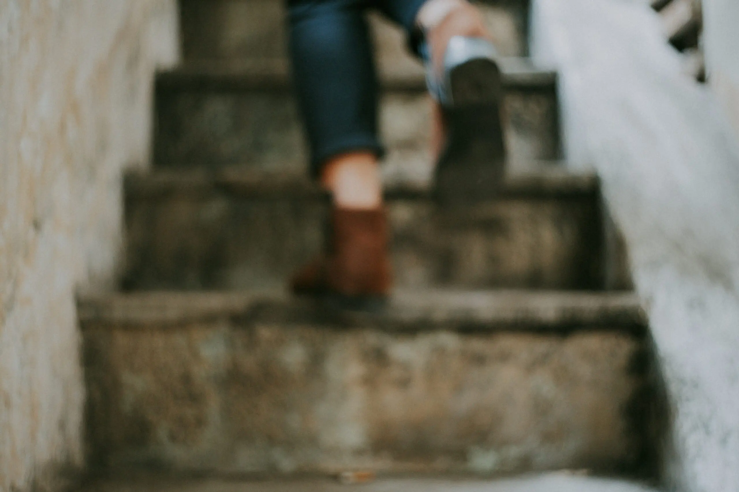 Feet running up a set of stairs
