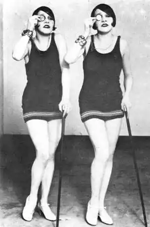Vintage photo of two twins dressed like flappers