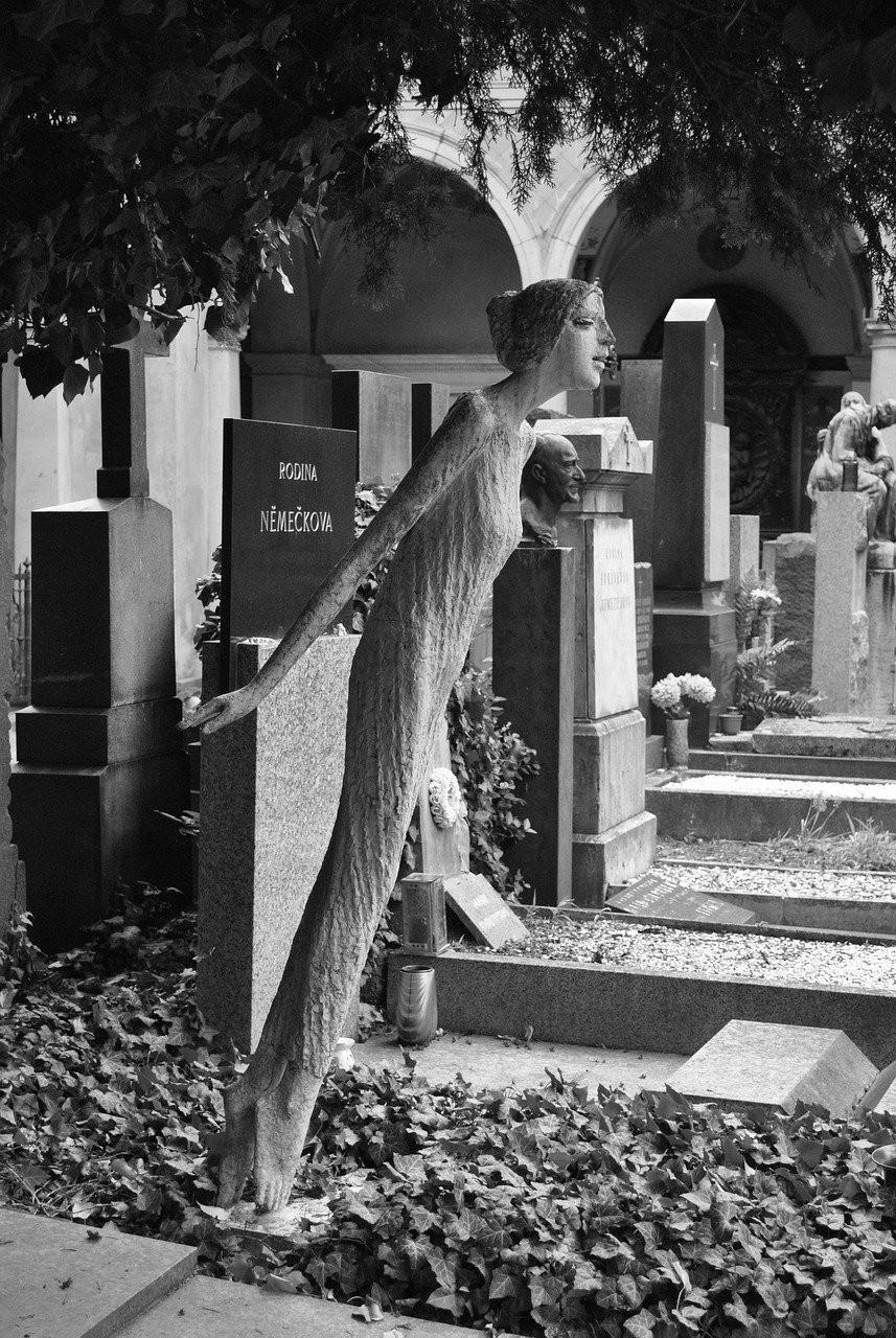 strange statue leaning forward in a cemetery