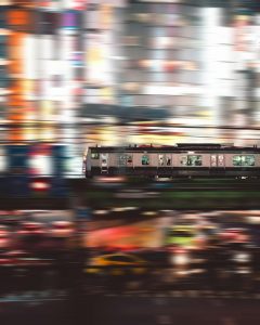 time lapse photography of people inside white and black train