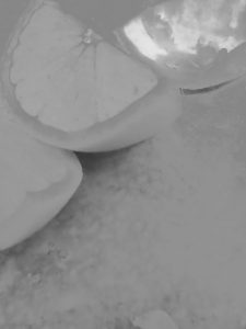 Black and white photo of sliced oranges