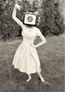 Vintage photo of a woman with a camera for a head