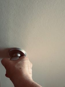 hand grabbing a door knob