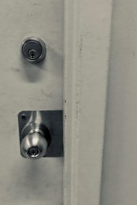 A closed door and deadbolt